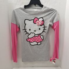 New With Tags Size Xl By Hello Kitty Sanrio Long Sleeve Under T-Shirt Look Though It Is The Same Shirt Grey Shirt Pink Sleeves Hello Kitty Printed On Shirt 3d Flower Tee 90% Cotton & 10% Polyester Sleevesn Some Measurements: Under Arm To Under Arm About 15.5" Middle Collar Back To Middle Hem About 25.5" Hem Across About 17" Shoulder To Shoulder About 15" Shoulder To Seam Of Sleeve About 23.5" Long Sleeve Under T Shirt, Curly Hair Photos, Hello Kitty Sanrio, Girls T Shirt, Cat Shirts, Grey Shirt, Polka Dot Dress, Dot Dress, Pink Bow