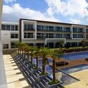 a large building sitting next to a swimming pool