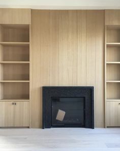 an instagram page with a fireplace and bookshelves