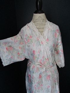 "Vintage Barbizon robe in white with pink, blue and green floral print and white lace. 40% Nylon 30% Cotton 30% Polyester. Size Large. Two pockets with tie on iniside and outside sash to keep it closed. 20.5\" underarm to underarm 11.5\" sleeve 51\" length" White Floral Print Sleepwear For Spring, Summer Robe With Lace Trim For Daywear, White Lace Trim Sleepwear For Spring, Fitted Spring Daywear Robe, Fitted Robe For Spring Daywear, Fitted White Floral Print Sleepwear, White Lace Trim Robe For Summer, White Lace Sleepwear For Spring, White Feminine Fitted Robe