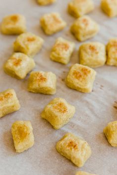 small pieces of food sitting on top of a baking sheet