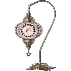 an antique style lamp with a star on it