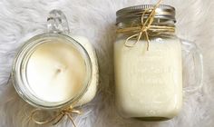 two jars filled with white liquid sitting next to each other