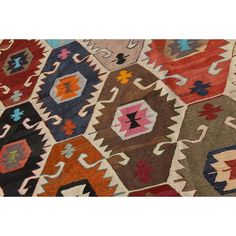 an old rug with many different colors and shapes