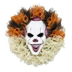 a creepy clown mask with curly hair around it