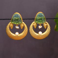 Fancy Party Wear Traditional Jhumki Earrings. Perfect with ethnic & traditional wear. Perfect gift for any occasion for yourself and your dear ones. These Earrings can be worn with all kind of Outfits. It is advisable to store jewellery in a zip lock pouch (air tight pouch), keep away from water perfume and other chemicals and clean it with dry and soft cloth. Wedding Chandbalis With Matching Earrings For Navratri, Gold Dual-tone Chandbalis For Celebration, Festive Temple Jewelry Danglers Gift, Gold Fusion Hoop Earrings For Festive Season, Gold Dual-tone Chandbali Earrings, Festive Fusion Style Gold Hoop Earrings, Festive Fusion Gold Hoop Earrings, Green Bridal Earrings With Cutdana As Gift, Festive Peacock Design Earrings