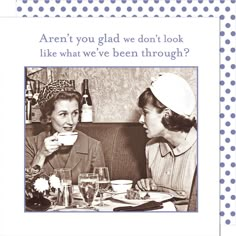 two women sitting at a table with cups and plates in front of them, talking