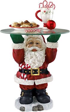 a santa clause holding a tray with food on it