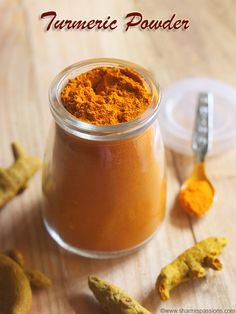 turment powder in a glass jar with two spoons next to it on a wooden table