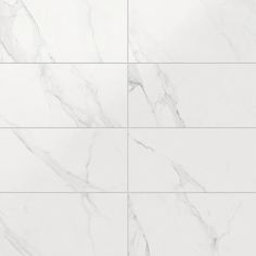 a white marble tile wall that looks like it has been cleaned