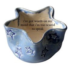 a blue bowl with stars on it and a poem written in the bottom right corner