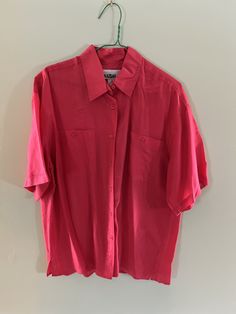 "This is a 100% silk loose fit short sleeve button down shirt. It would work for men or women, great vintage item.  Condition: Very good vintage. Best fits women's: Large / Labelled Medium Material: 100% silk MEASUREMENTS Taken from seam to seam while the garment is lying flat. Double the armpit, waist, and hips Measurements -  Length from Top: 29\" Armpit to Armpit: 24\" Waist: 23\" Shoulder to Shoulder: 21\" Sleeve: 10\"" Vintage Solid Color Short Sleeve Shirt, Vintage Short Sleeve Blouse With Pockets, Solid Vintage Summer Shirt, Vintage Summer Shirt, Red Silk Shirt, Button Up Shirt Short Sleeve, Oversized Streetwear, Crimson Red, Mens Vintage