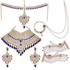 Prepare for your Indian wedding with the exquisite Blue Full Bridal Jewelry Set meticulously crafted by Jai Ho India. Plated with luxurious 18K gold, our jewelry showcases world-class craftsmanship and genuine plating of exceptional quality. This alluring set includes a captivating necklace, elegant earrings, a delicate nose ring, a stunning mathapatti, and ornate hathphool, each designed to elevate your bridal ensemble with timeless elegance and sophistication. Full Bridal Jewellery Set, Blue Bridal Jewelry, Bridal Jewelry Set, Bridal Jewelry Collection, Necklace Elegant, Blue Bridal, Jewelry Showcases, Bridal Jewelry Sets, Elegant Earrings