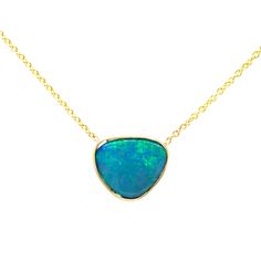 "This beautiful boulder Opal is framed by 14 karats yellow gold, shiny-finished with an 18-inch cable chain attached. This is from our \" Opalescence collection\". Each stone is unique and natural, one of a kind, handpicked. We design the piece based on the shape of the stone, to give it its unique personality. [MATERIALS] Accent Stones: Opal (1) Carat: 2.08 Clarity: eye clean Play of color: blue green Cut: triangle Type of Opal: Australian Bdoublet Origin: Queensland, Australia Clarity and Tran Blue Opal Necklace, Necklace Opal, Types Of Opals, Opal Pendant Necklace, Rustic Jewelry, Necklace Green, Queensland Australia, Green Necklace, Opal Pendants