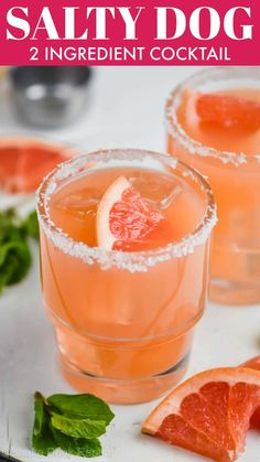 two glasses filled with grapefruit and garnished with salt