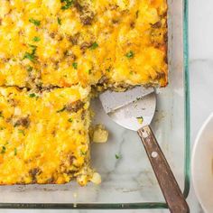 a casserole dish with meat and cheese on it, ready to be eaten