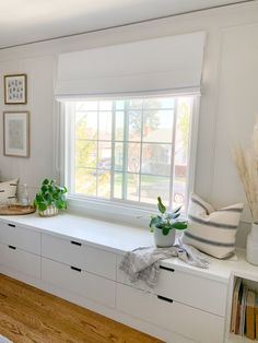 a living room filled with furniture and lots of windows