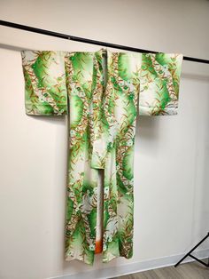 Vintage authentic Japanese Homongi kimono. Houmongi is a formal/high class kimono. It can be worn at wedding ceremony, wedding party, prestigious party, visiting somebody's house, the occasion of a family celebration etc. Click the link to learn more "About Kimono". *Obi and accessories are sold separately. Check out our obi . Availability may vary between the store and online, Please feel free to email us to confirm stock. *Obi and accessories are sold separately. Check out our obi . Availabili Green Kimono With Kimono Sleeves For Tea Ceremony, Green Long Kimono With Floral Print, Long Green Kimono With Floral Print, Green Long Floral Print Kimono, Long Green Floral Print Kimono, Traditional Green Kimono For Summer, Traditional Green Summer Kimono, Traditional Green Kimono For Spring, Long Green Kimono For Spring