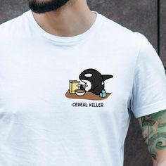 This "Cereal Killer" unisex t-shirt is perfect for any orca lover! The material is 100% Organic ring-spun combed cotton. The inks used in the print are water-based and non-toxic. Available in White and Grey. Available in sizes XS - XXL. Organic Cotton Crew Neck Shirt With Screen Print, Organic Cotton Graphic Tee Shirt With Crew Neck, Organic White Crew Neck Tops, Organic Cotton Crew Neck T-shirt With Branding, Organic Short Sleeve T-shirt With Screen Print, Everyday Organic Cotton T-shirt With Graphic Print, Everyday Organic Cotton Graphic Print T-shirt, Organic Cotton Pre-shrunk T-shirt, Everyday Organic Cotton Graphic T-shirt