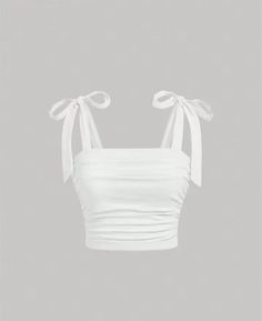 Step into summer with grace in this chic white crop top. The ruched design adds texture, while the tie-up shoulder straps allow for a customizable fit. Whether you're strolling on the beach or enjoying a rooftop brunch, this versatile piece is a must-have. Made from stretchable fabric, it's comfortable and stylish. Elevate your wardrobe with this minimalist yet eye-catching top!  😊🌟 Wide Straps Top, Preppy Tops, Tie Up Crop Top, Cute Summer Tops, Women Tank Tops, Plus Size Tank Tops, White Bow, Teenage Fashion Outfits, White Crop Top