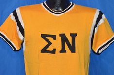 a yellow jersey with the letter nz on it is hanging from a mannequin's head