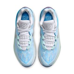 a pair of sneakers with blue and white paint on the upper part of their shoes