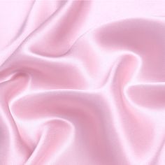 a close up view of a pink satin fabric