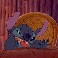 stitch from the movie stitch smiling and pointing at something