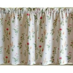 a window curtain with flowers on it