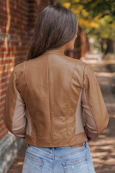 Add an edgy twist to your outerwear collection with the Brown Two Tone Faux Leather Jacket. This versatile piece combines a bold two-tone design with the sleek look of faux leather, creating the perfect jacket for the modern boho woman. Whether you're layering it over a dress for a night out or styling it with jeans for a casual day look, this jacket adds a perfect mix of attitude and sophistication to your wardrobe. Trendy Fall Leather Jacket With Faux Pockets, Trendy Faux Leather Jacket With Faux Pockets, Chic Brown Leather Biker Jacket, Trendy Brown Fitted Leather Jacket, Trendy Fitted Brown Leather Jacket, Fitted Brown Faux Leather Outerwear, Trendy Brown Faux Leather Biker Jacket, Trendy Brown Leather Biker Jacket, Chic Leather Outerwear For Layering