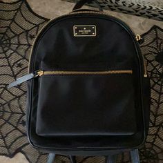 Kate Spade Back Pack Purse, Lots Of Pockets. Front Zip Pocket, Straps And Zippers Like Brand New. Only Worn Once Or Twice Kate Spade Backpack For Errands, Kate Spade Black Backpack For Errands, Black Kate Spade Backpack, Kate Spade Black Everyday Backpack, Classic Kate Spade Backpack With Zipper Closure, Black Kate Spade Standard Backpack, Kate Spade Black Backpack, Luxury Kate Spade Black Backpack, Kate Spade Black Standard Backpack