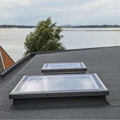 two flat panels on the roof of a house