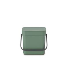 a green lunch box sitting on top of a white table next to a black handle