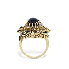 Gracefully crafted from 18Kt yellow gold, this Oval Black Onyx Estate Ring emanates opulence. Includes 16 single-cut diamonds. Accented with a sleek black enamel finish, crafted circa 1960's, this extraordinary piece is sure to turn heads. Size 5.25. Oval Black Onyx, Diamond and Enamel Yellow Gold Estate Ring 18kt. Yellow Gold 16pcs Single Cut diamonds Diamonds: Est. 0.33ct G/H SI TW Oval Black Onyx Black Enamel Circa 1960's Size 5.25 H&H Estate Collection SKU: 22732 Estate Rings, Selling Jewelry, Black Enamel, Black Onyx, Gold Diamond, Onyx, Diamond Cuts, Vintage Jewelry, Diamonds