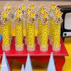 corn on the cob in plastic cups with stickers