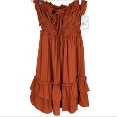 Forever 21 Ruffle Trim Mini Dress Rust Color Self Tie Chest Smocked Waist Size Xs Measurements Are Approx Laid Flat Pit To Pit 14” Length 27” Strapless Casual Mini Dress With Ruffle Hem, Ruched Ruffle Midi Dress For Summer, Flowy Strapless Mini Dress With Ruffles, Strapless Flowy Mini Dress With Ruffles, Forever 21 Strapless Spring Dresses, Knee-length Ruffle Mini Dress, Strapless Spring Dresses From Forever 21, Strapless Spring Dresses By Forever 21, Strapless Summer Midi Dress With Ruffles