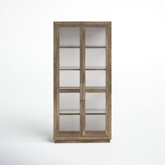 an old wooden bookcase with glass doors on the front and side, against a white background