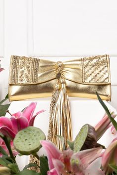 Gold clutch embroidered with sequins and cutdana embellished tassels. - Aza Fashions Festive Evening Bags With Tassels, Festive Gold Bag With Tassels, Festive Celebration Bags With Tassels, Elegant Festive Bags With Tassels, Elegant Festive Tassel Bags, Festive Party Bags With Tassels, Luxury Formal Clutch With Tassels, Festival Party Bags With Tassels, Party Bags With Tassels For Festivals