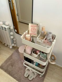 a white shelf filled with lots of personal care items on top of a carpeted floor