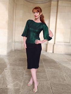 OBERON is superbly versatile top which will elevate any outfit. Great for festive season.  It is made from shimmer foil rib poly jersey currently in 3 wonderful colours.  Dark green , Red, Blue.  Features:  - Boat neck line - Fitted cut - 3/4 length sleeves with side slits - Easy care material - Length aprox. 52cm ( give little allowance)  The top can be made without slits as personalisation, please contact me with your requests.  Please include bust and waist measurements with you order. Green Stretch Tops For Evening, Green Stretch Blouse For Night Out, Stretch Green Blouse For Night Out, Elegant Green Stretch Top, Fitted Green Top For Holiday, Fitted Green Top For The Holiday Season, Festive Stretch Tops For Fall, Festive Fall Stretch Tops, Shimmer Stretch Tops For Night Out