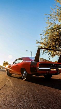 an old car parked on the side of the road