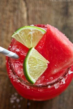 a watermelon drink with lime and sugar on the rim