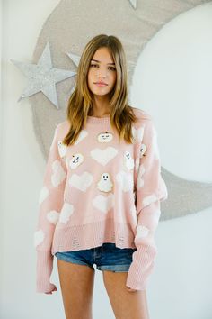 Get ready for a spook-tacular season with our HAPPY HAUNTINGS SWEATER. Featuring a playful combination of pink hearts, white pumpkin patches, and ghost patches, this cozy sweater is perfect for Halloween lovers. It's sure to keep you warm while also spreading some festive cheer. All orders are currently shipping within 14 business days. To receive item quicker, expedited shipping is available at checkout. **ALL HALLOWEEN ORDERS MUST BE PLACED WITH EXPEDITED SHIPPING TO GUARANTEE DELIVERY BY OCT. Cute Heart Print Sweater For Fall, Playful White Sweater For Fall, Playful Pink Loungewear Sweater, White Fun Sweater For Fall, Fun White Sweater For Fall, Girly Sweater, Pumpkin Patches, Judith March, Halloween Lovers