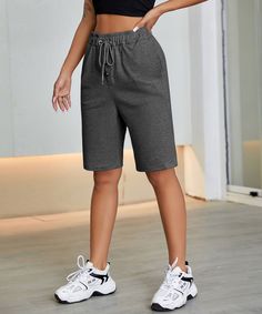 The EMES SHOP shorts are detailed with a classic solid color. Features a drawstring waist. side pockets. regular fit. and above knee length. Pair it with a cropped tank top and sneakers for an easygoing summer look.MATERIAL:100% Soft Poly MEASUREMENTS: Trousers Length is 20"-22"in Small | Waist: 25-37"in & Hip : 35-37"in Medium |Waist: 26-39"in & Hip : 37-39"in Large |Waist: 29-41"in & Hip : 39-41"in X Large |Waist: 31-44"in & Hip : 42-44"in MEASUREMENTS:Trousers Length is 53-56 cm Small |Waist: 64-96 cm & Hip : 91-96 cm Medium | Waist: 68-100 cm & Hip : 95-100 cm Large | Waist: 74-106 cm & Hip : 101-106 cm X Large | Waist: 80-112 cm & Hip : 107-112 cm Casual Cotton Bermuda Shorts With Drawstring, Gray Drawstring Shorts For Spring, Casual Shorts With Functional Drawstring For Leisure, Casual Solid Bermuda Shorts With Side Pockets, Casual Gray Bottoms With Functional Drawstring, Casual Cotton Athletic Shorts With Functional Drawstring, Spring Casual Bermuda Athletic Shorts, Casual Bermuda Athletic Shorts With Elastic Waistband, Casual Gray Athletic Shorts For Summer