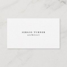 a white business card with the word sercio tumer architecture on it's front