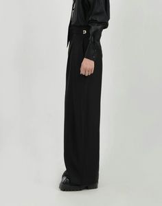 Elevate your wardrobe with the effortless sophistication of our Wide Leg Pleated Palazzo Trousers, complete with a sleek belt detail. These trousers are crafted from a premium polyester blend, offering both durability and comfort with a hint of stretch. The pleated design and wide-leg cut combine to create a fluid silhouette that exudes confidence, while the solid color and minimalistic style ensure they remain a timeless staple. The included belt not only accentuates the waist but also adds a structured element, making these pants versatile enough for casual outings or more formal affairs. Pair them with a tucked-in button-up shirt for a polished look or keep it relaxed with a soft tee and low-top sneakers. Product specifications: Material: 96% Polyester, 4% Spandex Fit: Loose, straight-l Versatile Formal Dress Pants, Formal Ankle-length Dress Pants, Elegant Wide Leg Bottoms With Belted Cuffs, Elegant Wide Leg Pants With Belt, Versatile Straight Dress Pants For Formal Occasions, Formal Wide Leg Bottoms With Belted Cuffs, Formal Wide-leg Bottoms With Belted Cuffs, Elegant Wide Leg Pants With Belted Cuffs, Formal Wide-leg Pants With Belted Cuffs