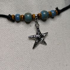 Looking for a unique and eye-catching accessory to add to your collection? Look no further than this Ceramic Beaded Starfish Spiral Swirl Charm Boho Hippie Whimsical Adjustable Black Rope Cord Choker Stacking Necklace. Crafted from high-quality ceramic beads this whimsical necklace is the perfect addition to your boho-inspired wardrobe. With ten different color options available, each necklace is made-to-order and features a slightly unique color variation. Designed on an adjustable waxed black Whimsical Necklaces, Whimsical Gothic, Beaded Starfish, Whimsical Necklace, Cord Choker, Spiral Necklace, Rope Cord, Stacked Necklaces, Black Rope