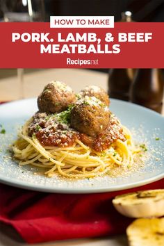 a white plate topped with spaghetti and meatballs