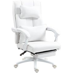 a white office chair sitting on top of a wooden table next to a pillow and pillows