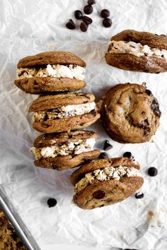 chocolate chip cookies with marshmallows and oreo cookies on white parchment paper